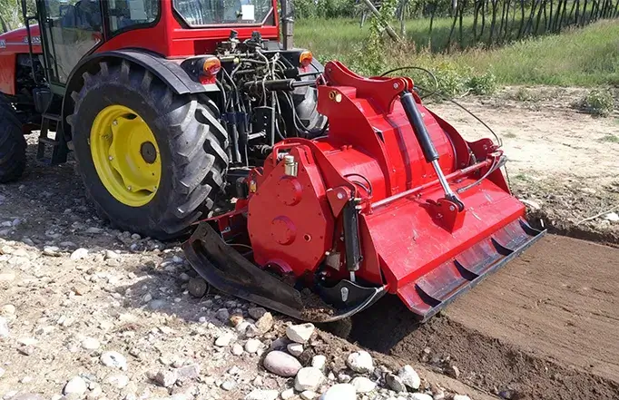 Tractor mounted rock crusher field operation